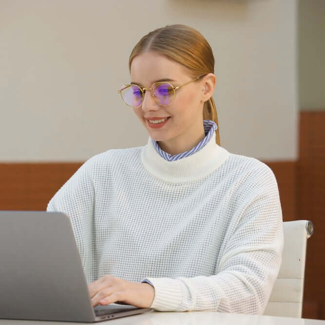 A woman wearing ANYLUV Rayne Everyday Protection's Blue Light Blocking Glasses